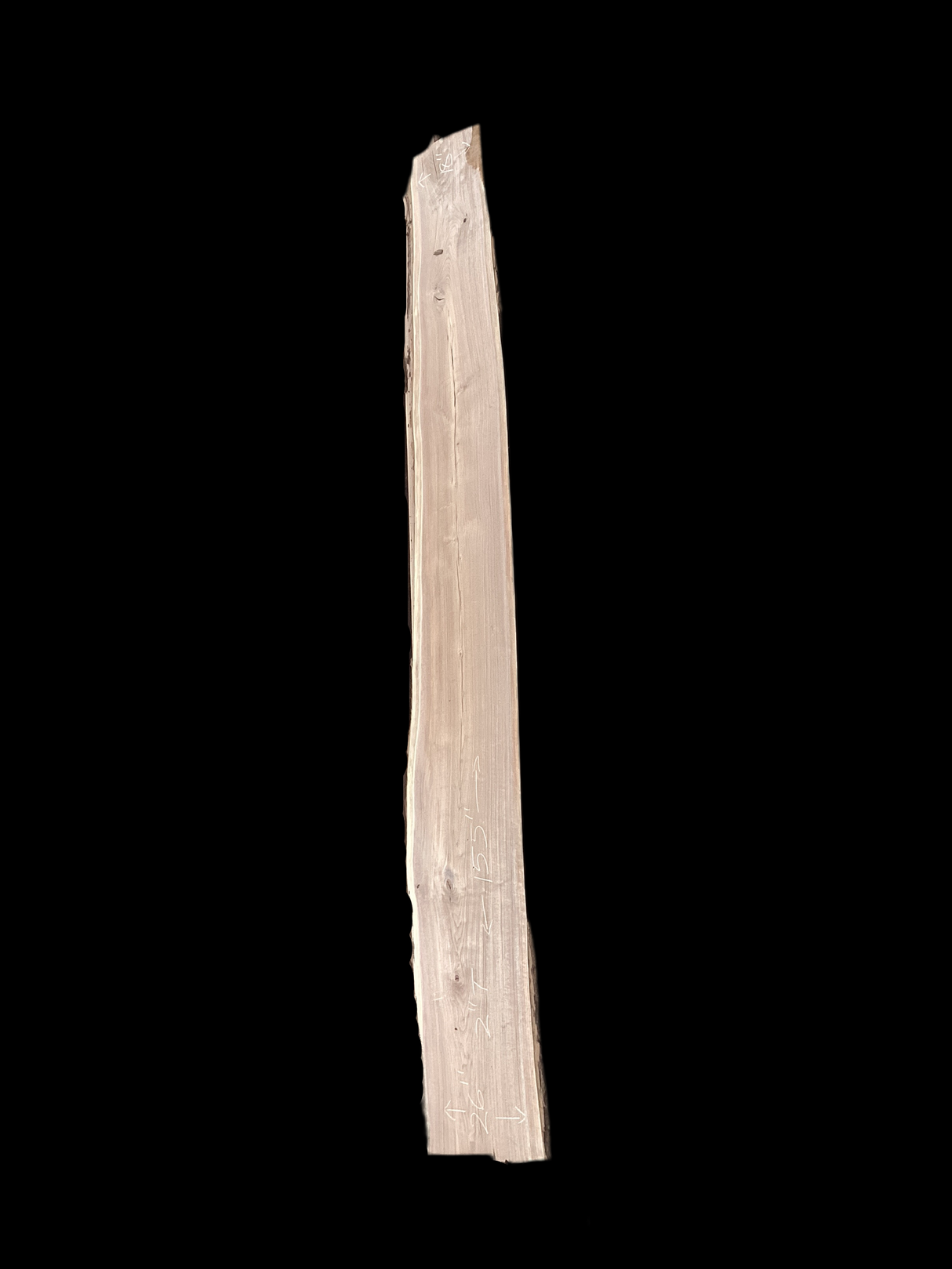 Large walnut wood slab with a black background.