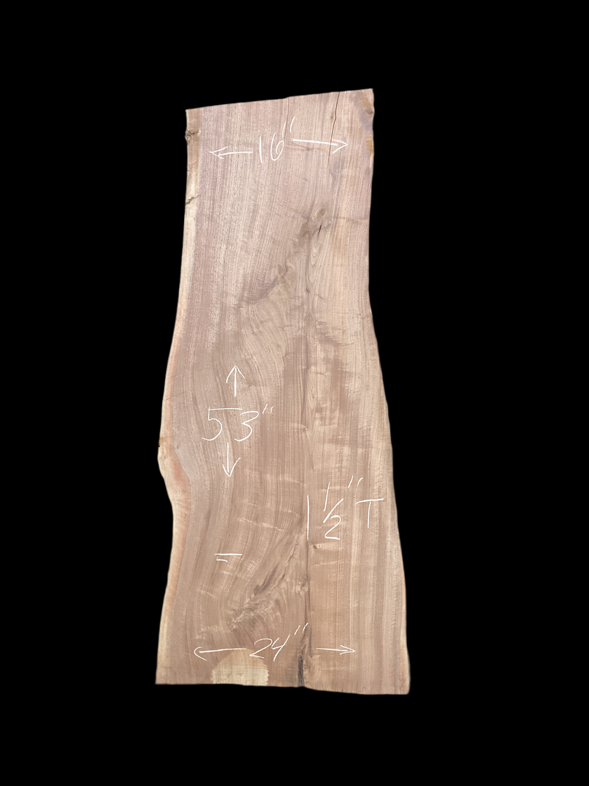 A short walnut slab with a black background.