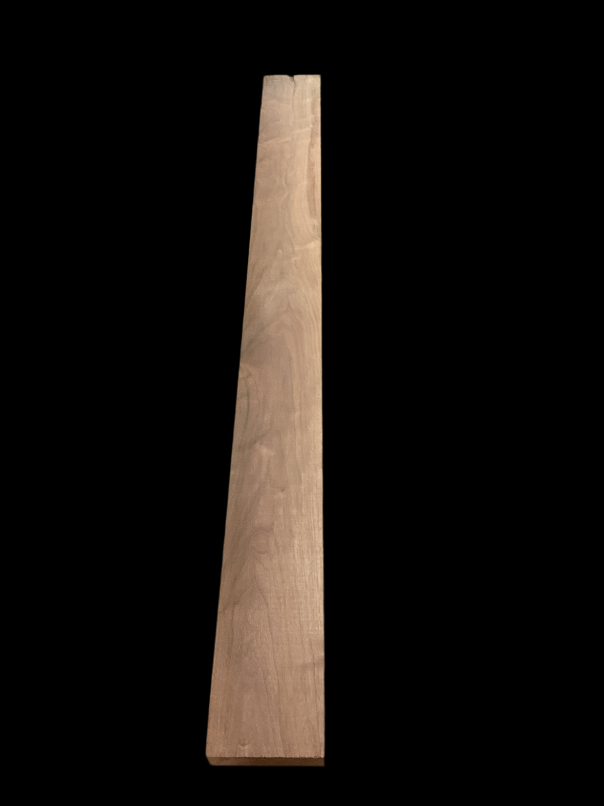 A walnut fireplace mantle with a natural finish, displaying the grain and color of the walnut wood.