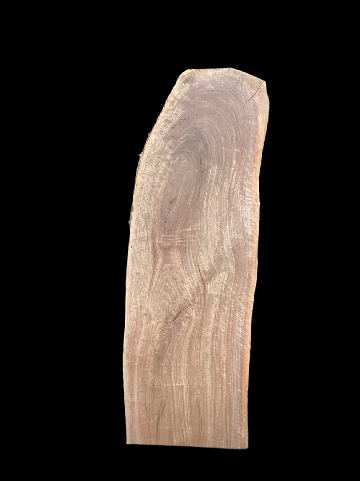 A short walnut slab with a black background.