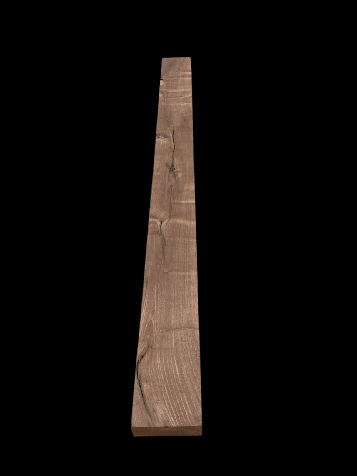 A walnut fireplace mantle with a natural finish, displaying the grain and color of the walnut wood.