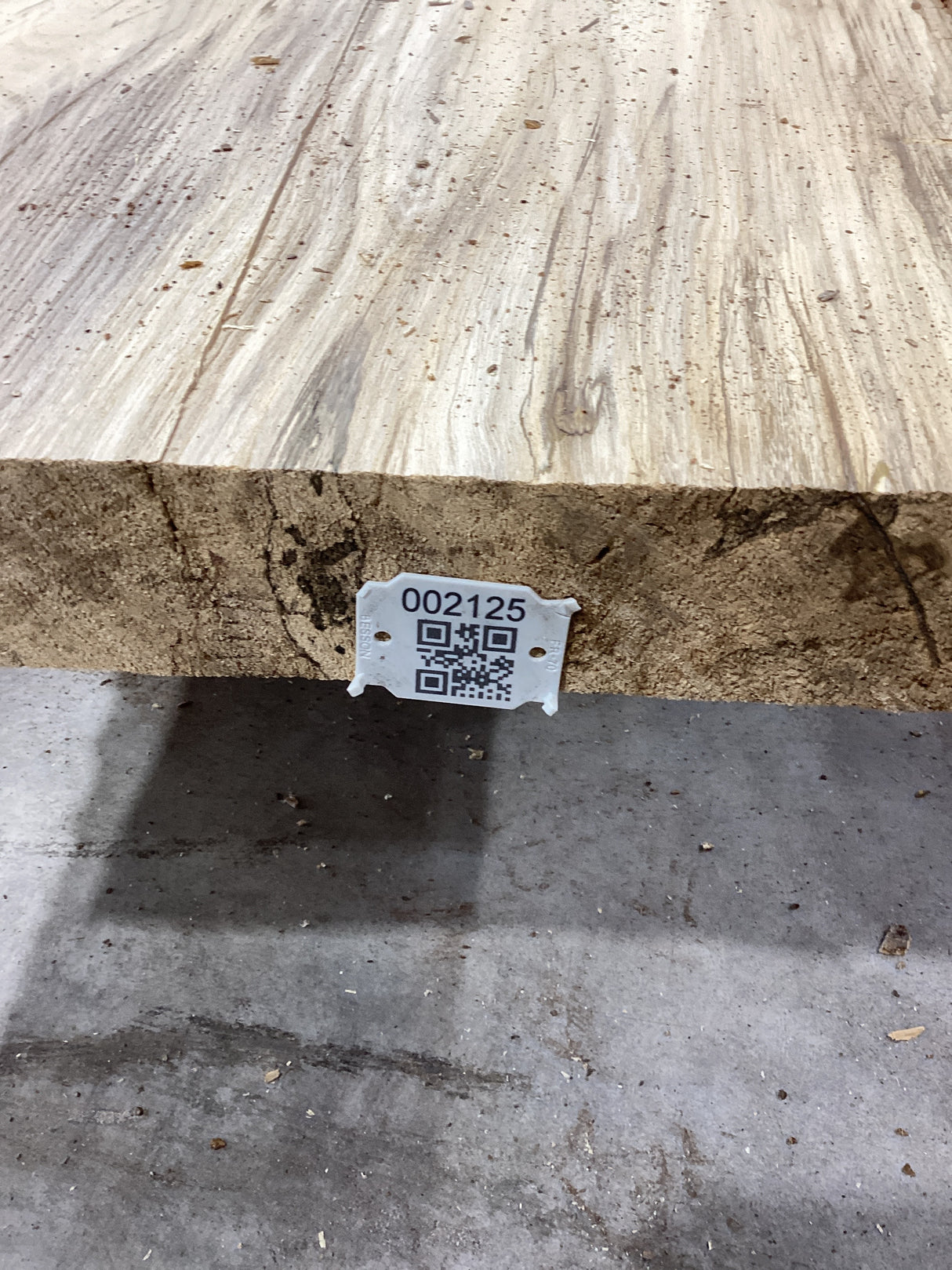 QR label on the edge of a Hackberry slab.