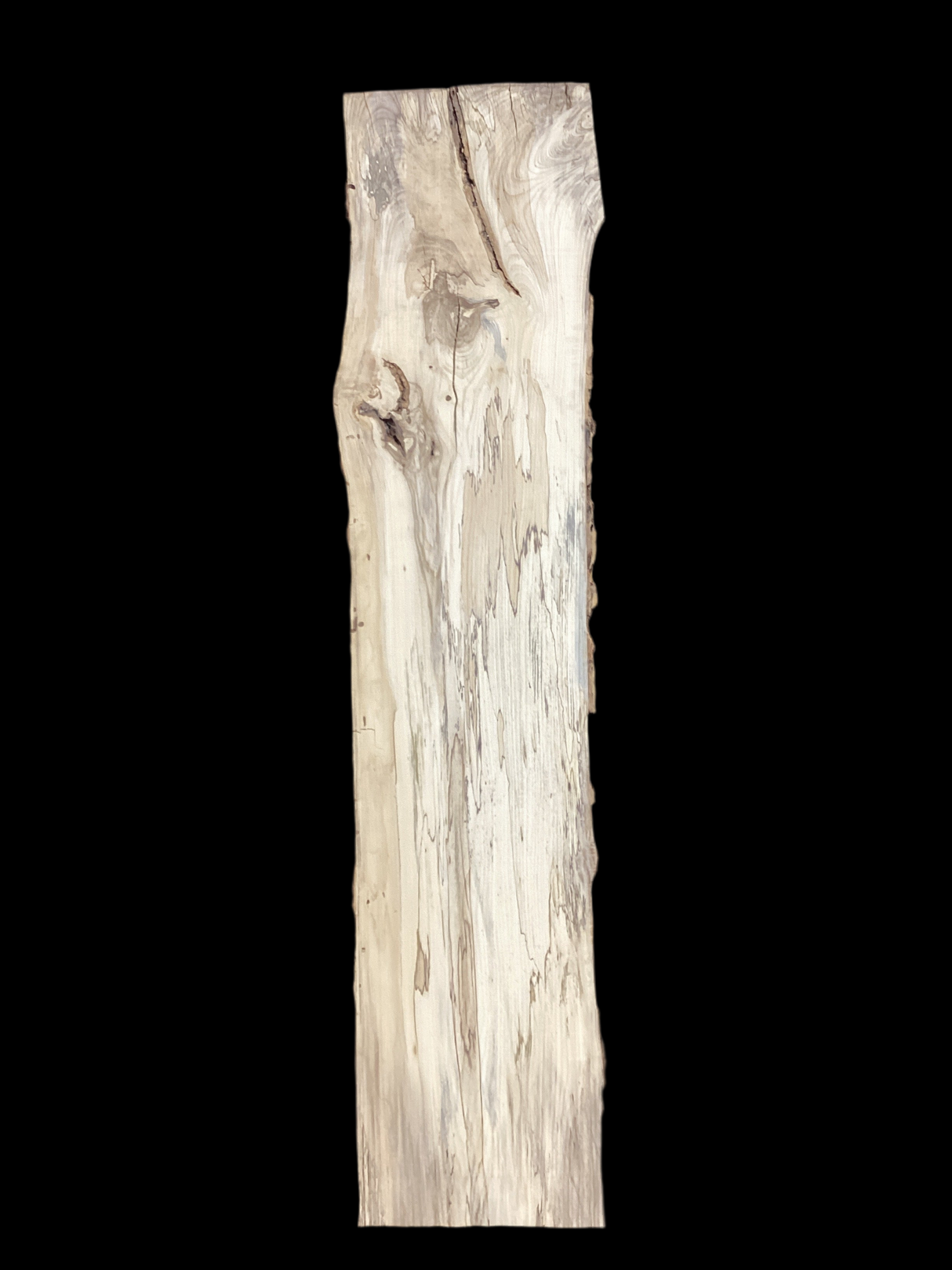 A single slab of Hackberry wood with visible grain and some knots with a black background.