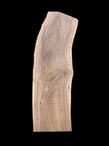 A short walnut slab with a black background.