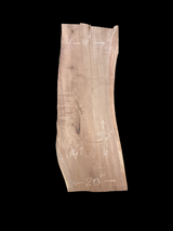 A large walnut slab with a black background.