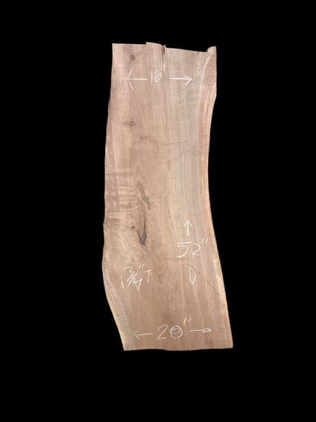 A large walnut slab with a black background.