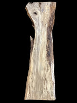 A table-sized slab of Hackberry wood with a prominent live edge, featuring a beige and brown color palette.