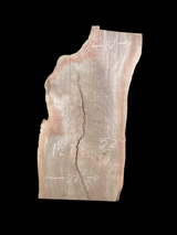 A short walnut slab with a black background.