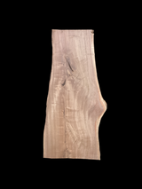 A large walnut slab with a black background.