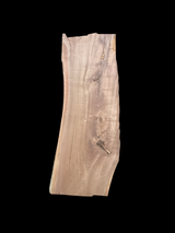 A large walnut slab with a black background.