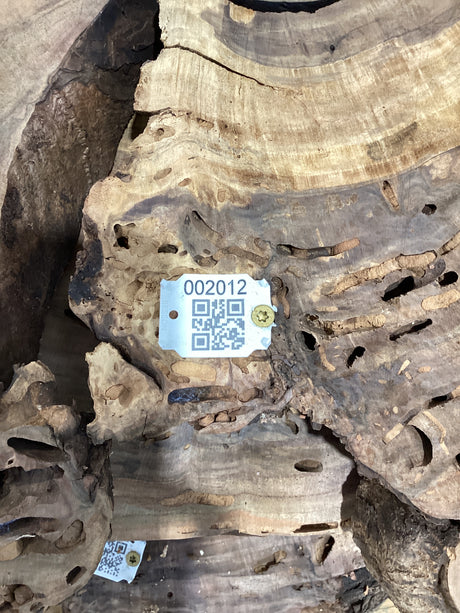 QR label attached to walnut wood slab.