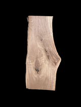 A short walnut slab with a black background.
