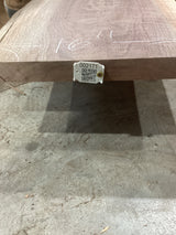 A walnut wood slab with a QR code tag attached to it, displaying potential design uses.