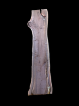 A walnut wood slab with a natural brown finish on a black background.