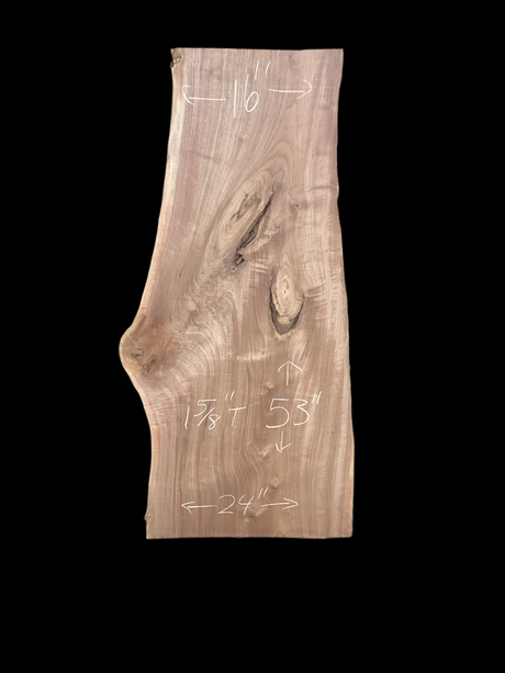 A large walnut slab with a black background.