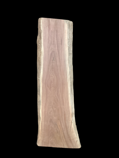 A short walnut slab with a black background.