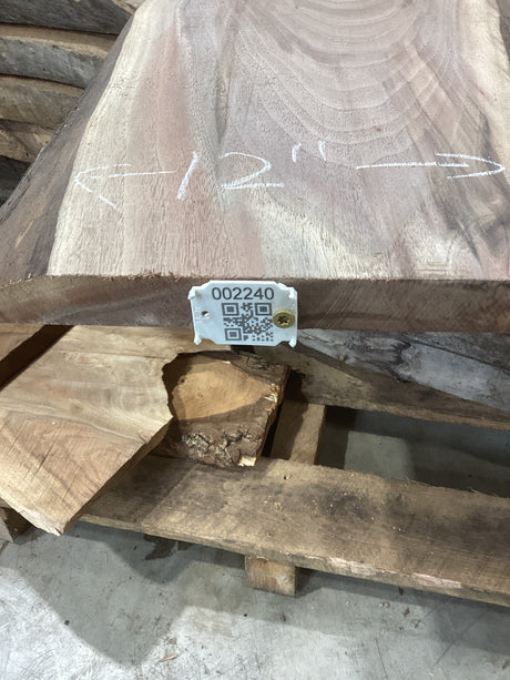 A walnut slab with a visible wood grain, marked with measurements and a QR code.