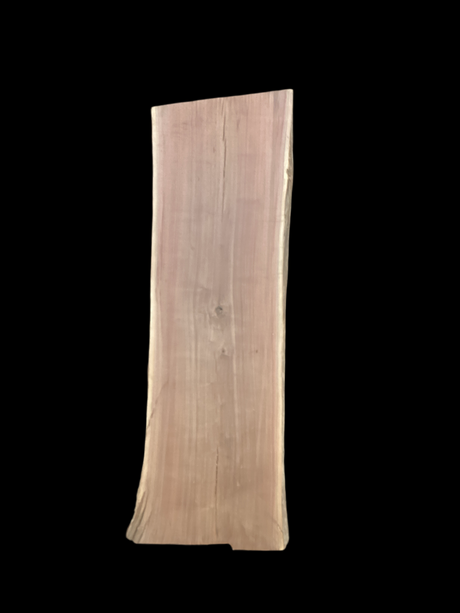 Large walnut wood slab with a black background.