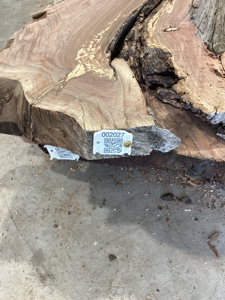 QR label attached to the edge of a Walnut slab.