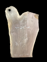 A short walnut slab with a black background.