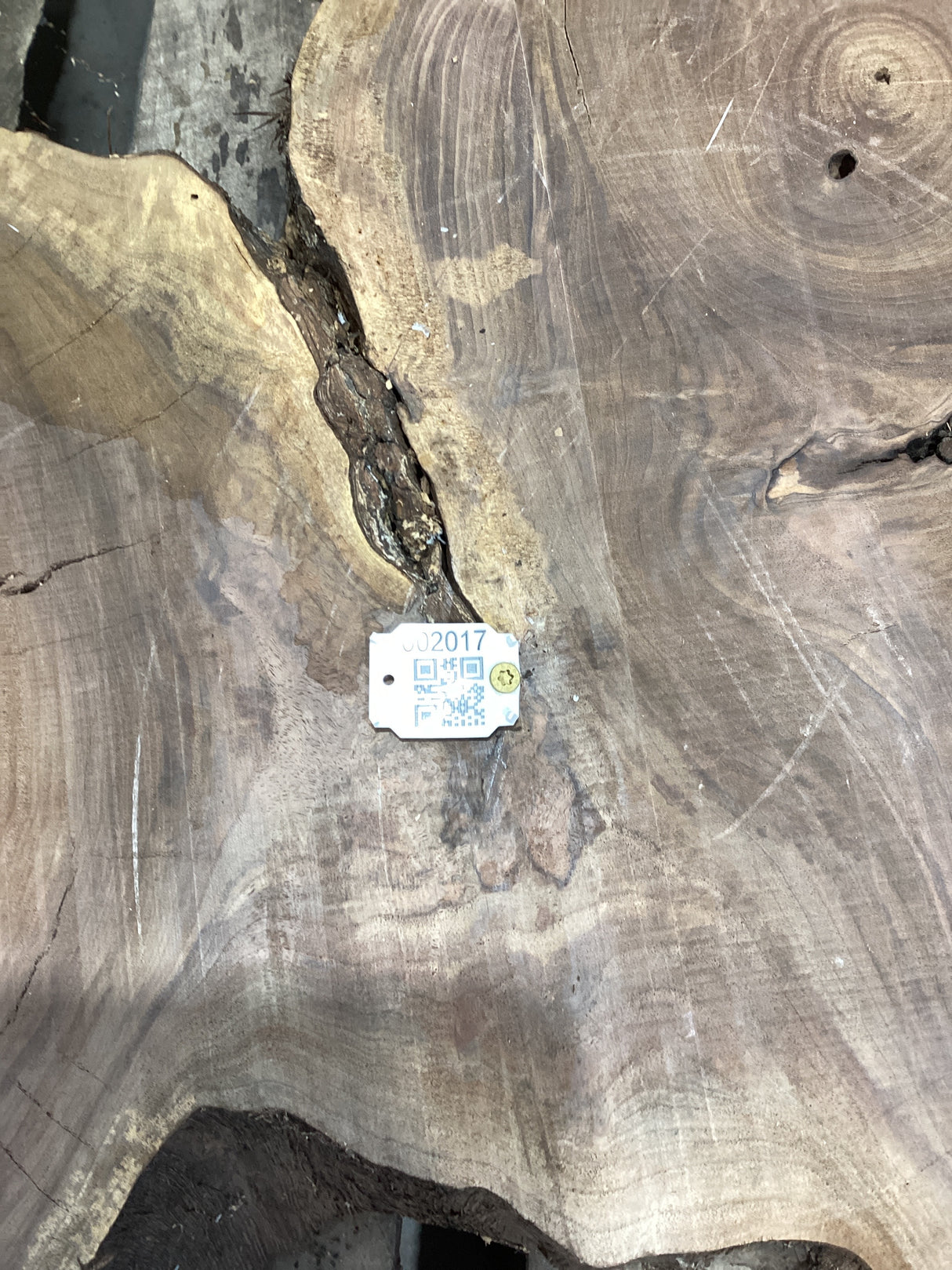 QR label attached to the walnut wood slab.