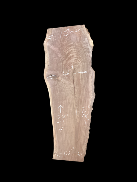 Large walnut wood slab with a black background.