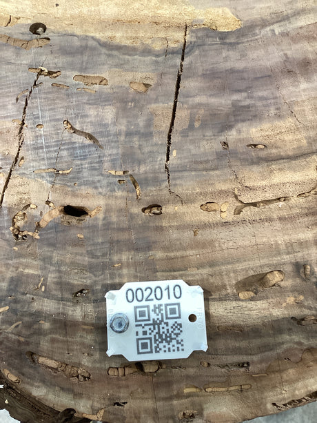 QR label attached to a walnut wood slab.