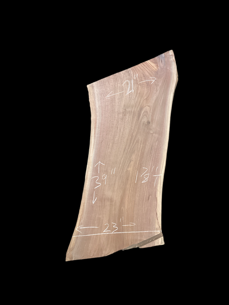 Walnut wood slab with a black background.