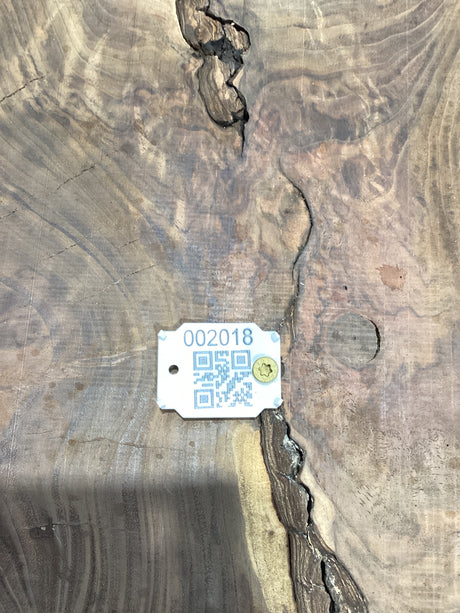 QR label on walnut wood slab.