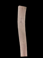 A long walnut wood slab on a black background.