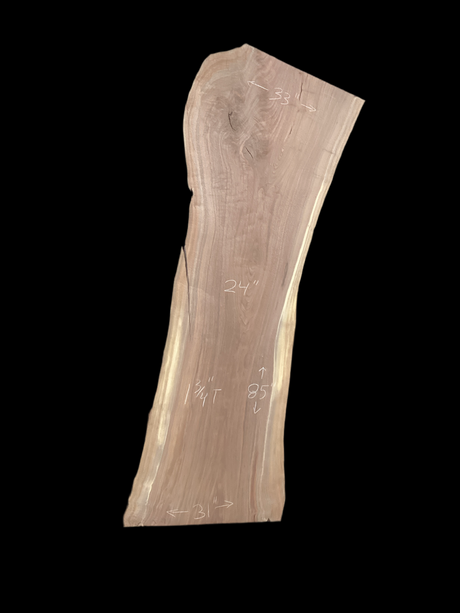 A short walnut slab with a black background. 