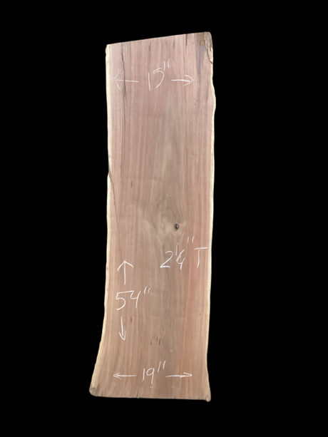 A short walnut slab with a black background.