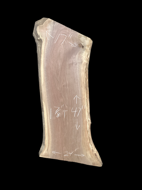 Walnut wood slab with a black background.