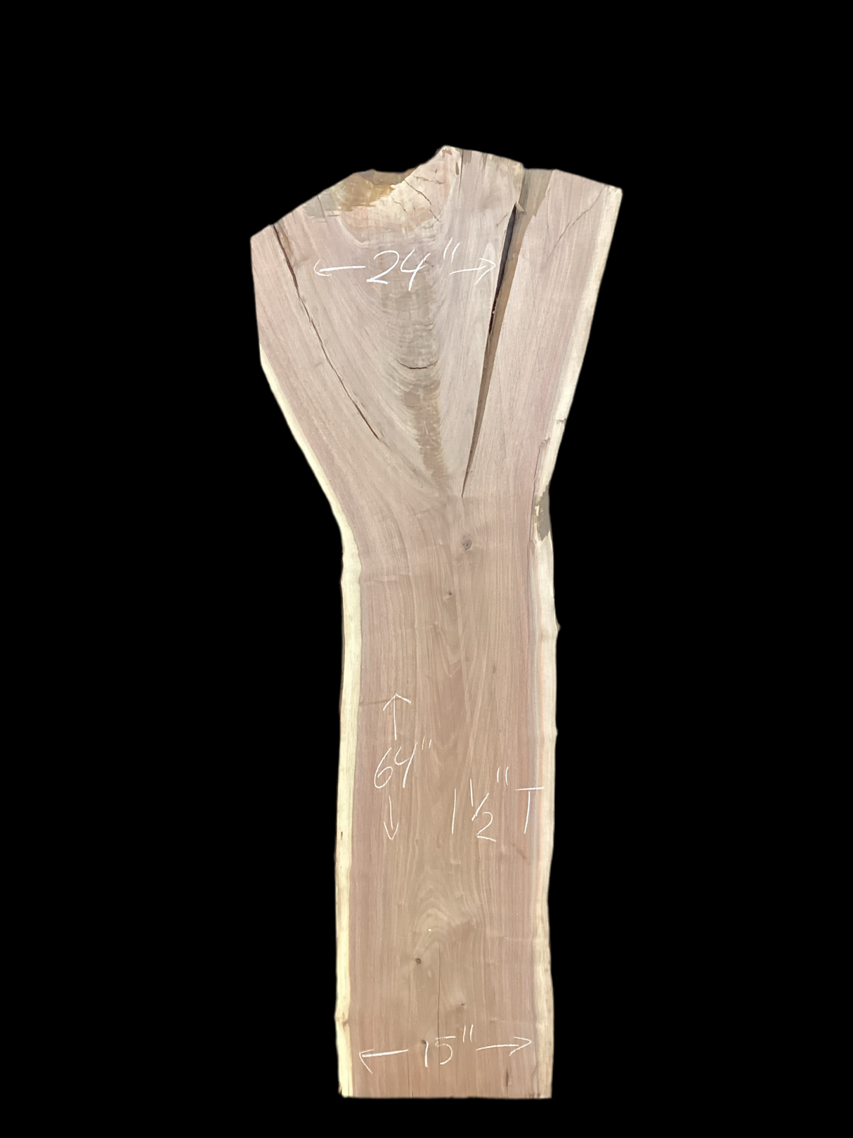 A large walnut slab with a black background.