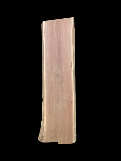 Large walnut wood slab with a black background.