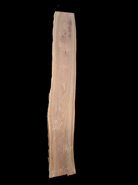 Large walnut wood slab with a black background.