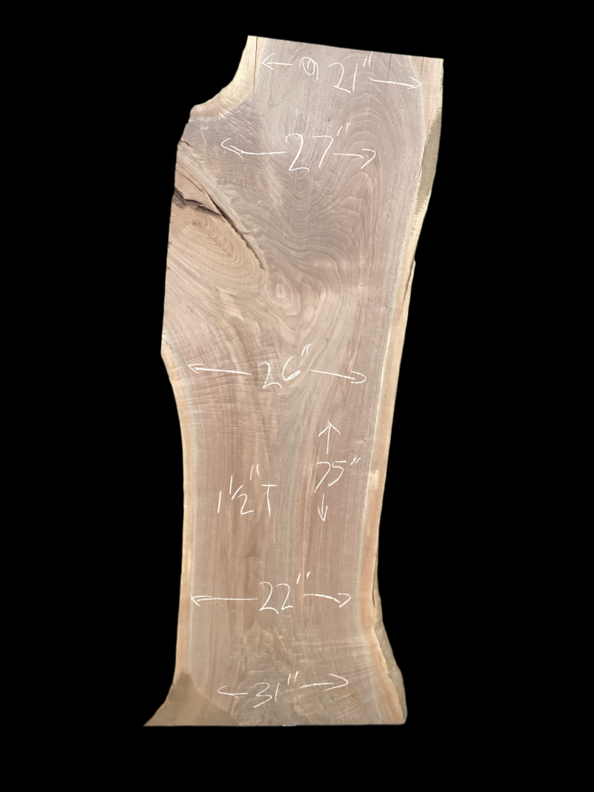 A short walnut slab with a black background. 
