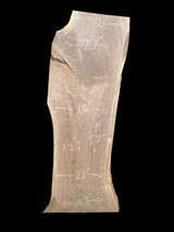 A short walnut slab with a black background. 
