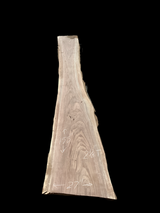 Large walnut wood slab with a black background.