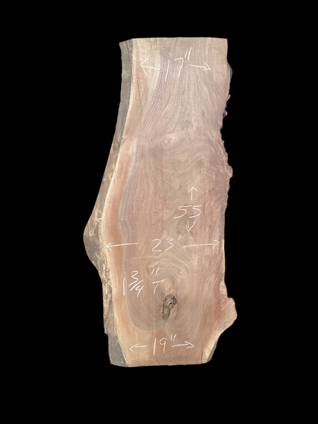 A large walnut slab with a black background.