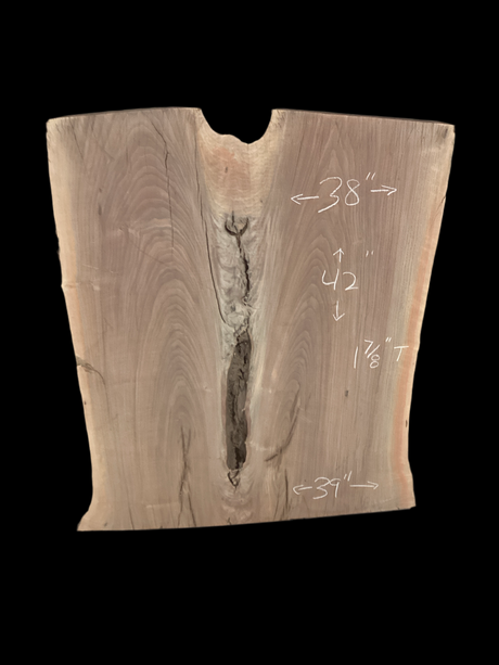 A short walnut slab with a black background. 