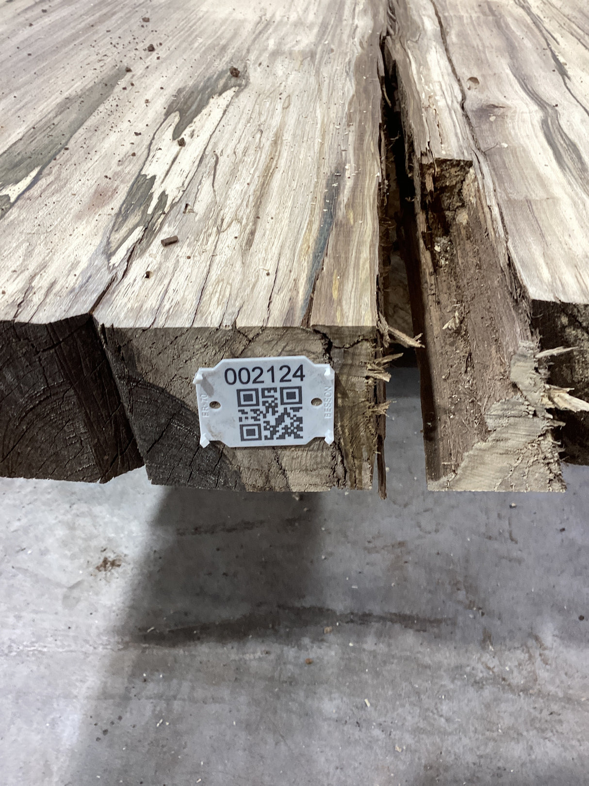 QR label attached to the edge of a Hackberry slab.