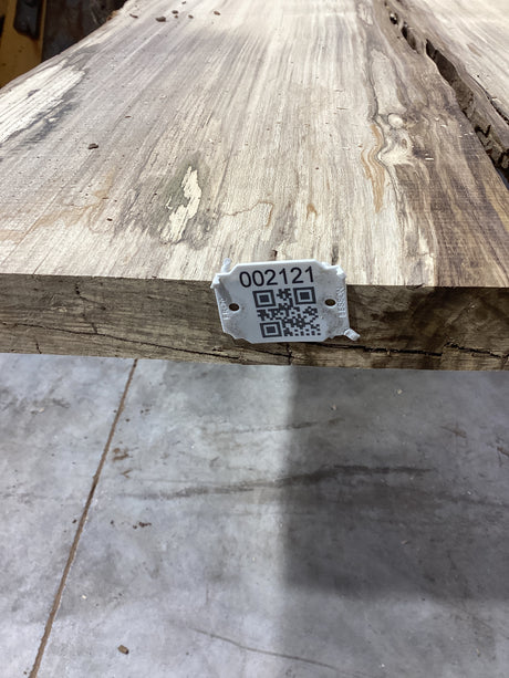 QR label attached to the edge of a Hackberry slab.