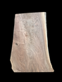 A short walnut slab with a black background.