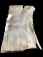 A Silver Maple wood slab with a natural, rustic appearance, featuring a beige to light brown color gradient and marked with some inscriptions.