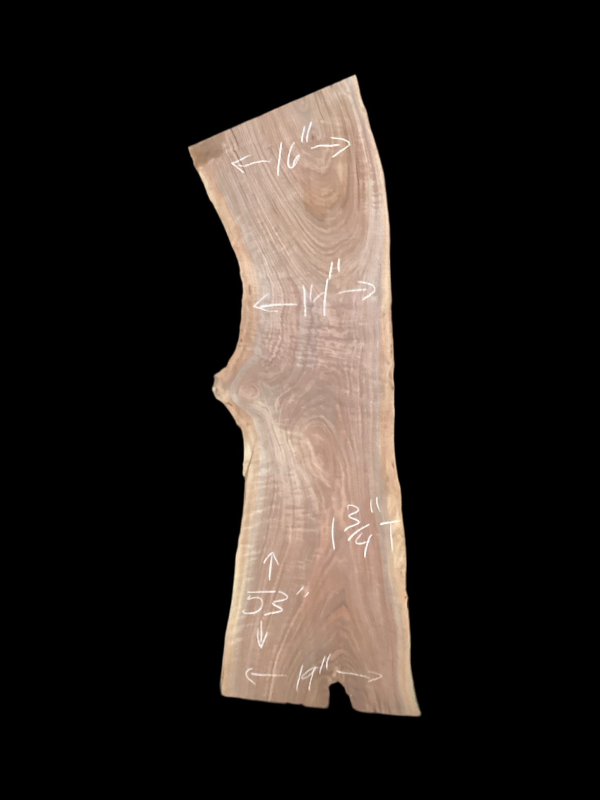 A short walnut slab with a black background.