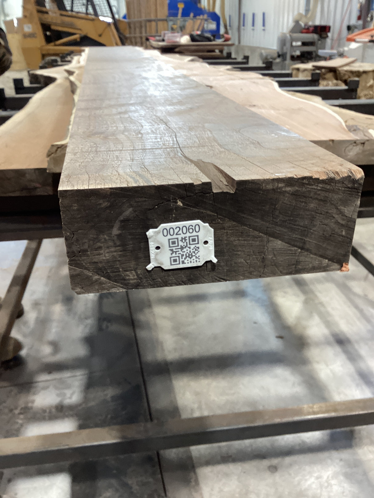 QR label attached to the edge of the walnut wood mantel.