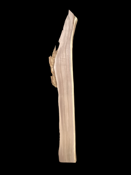 Large, narrow walnut wood slab with a black background.