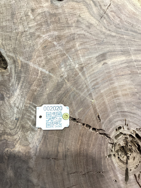 QR label attached to the walnut wood slab.