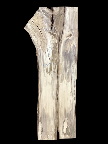 A table-sized slab of Hackberry wood with a prominent live edge, featuring a beige and brown color palette.